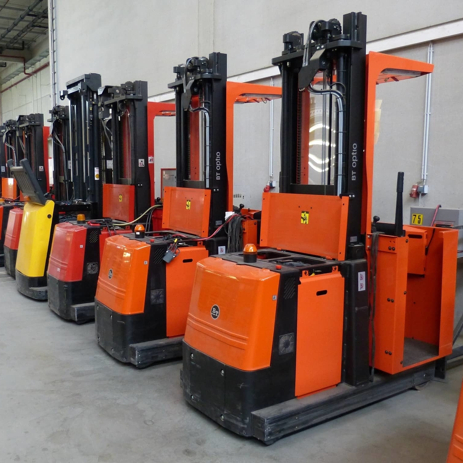 Forklifts parked in a warehouse